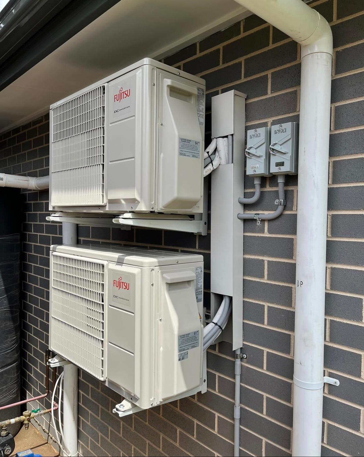 Toptech Air technician advising a customer on air conditioner options for their Sydney home