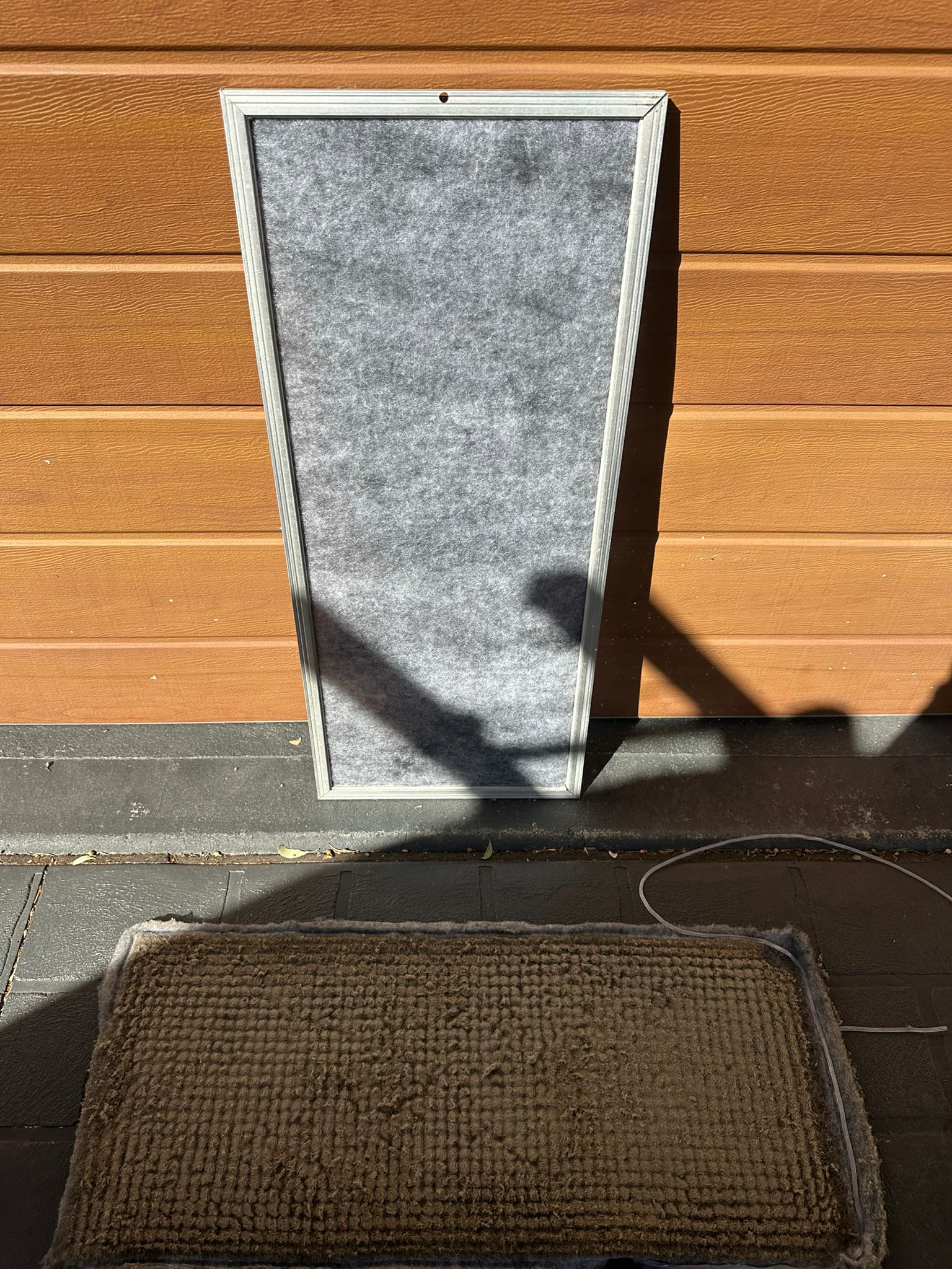 Licensed Toptech Air technician installing a split system air conditioner on an interior wall in Sydney